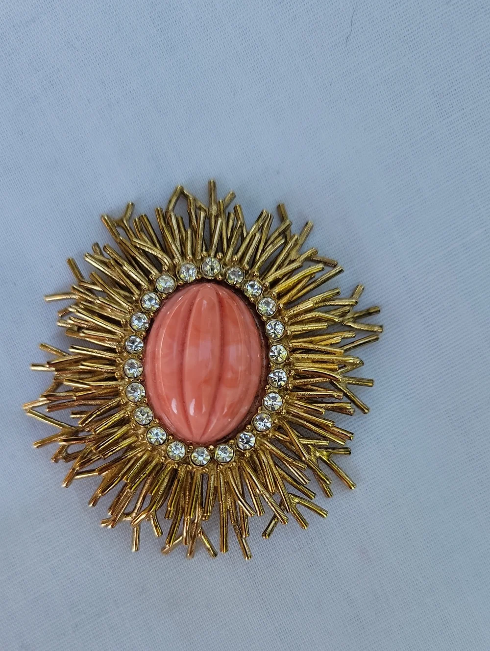 Vintage Joan Rivers Gold Sunburst Brooch with Coral Center